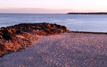 Fall is the perfect time to take a solitary beach walk in the purplish twilight.